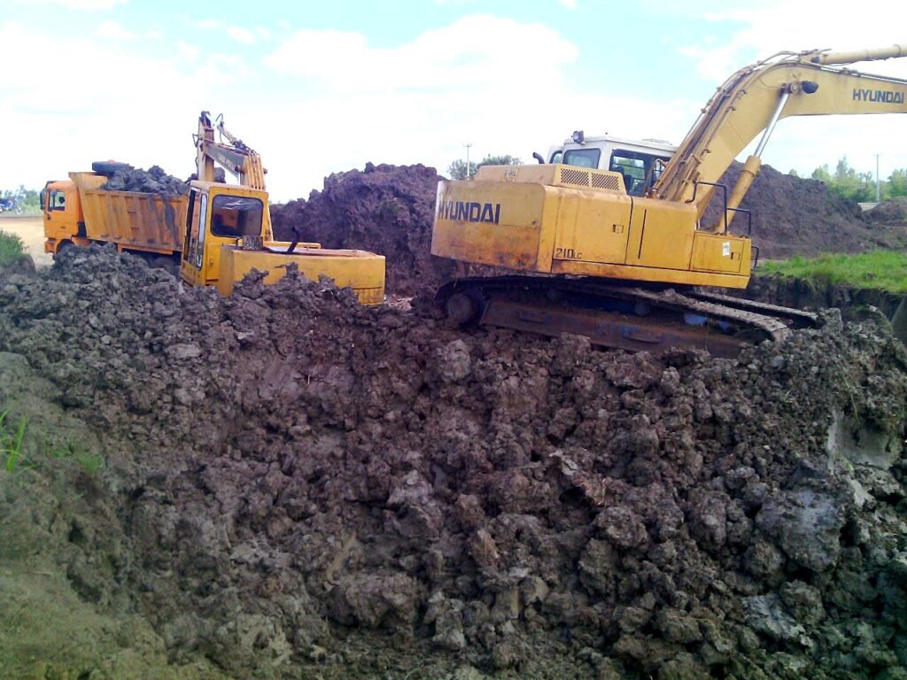 Excavators carrying out bulk earthworks and rock excavation