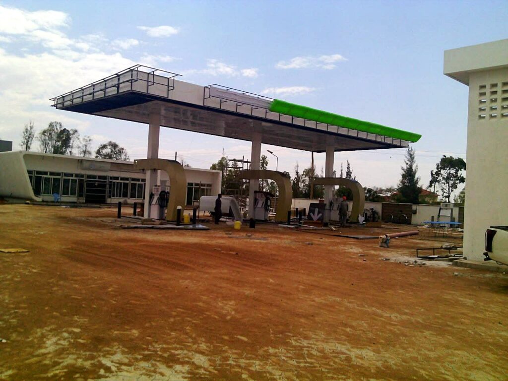 Canopy fascia being clad with dispensers in place