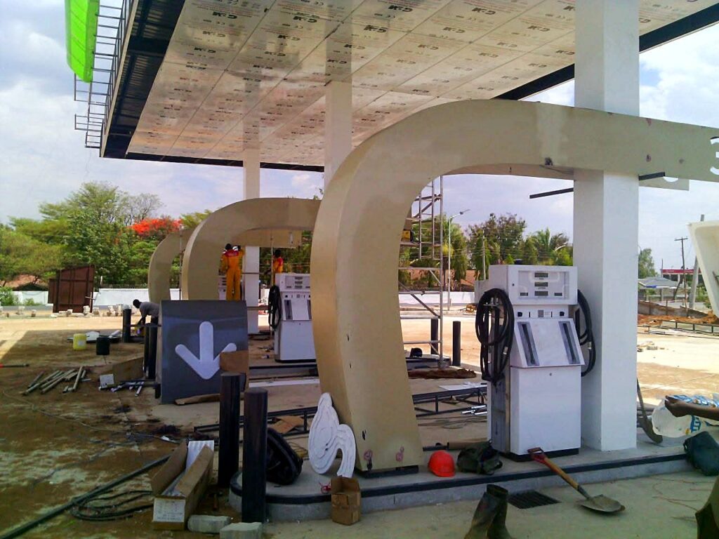 Fuel dispensers being installed under the canopy