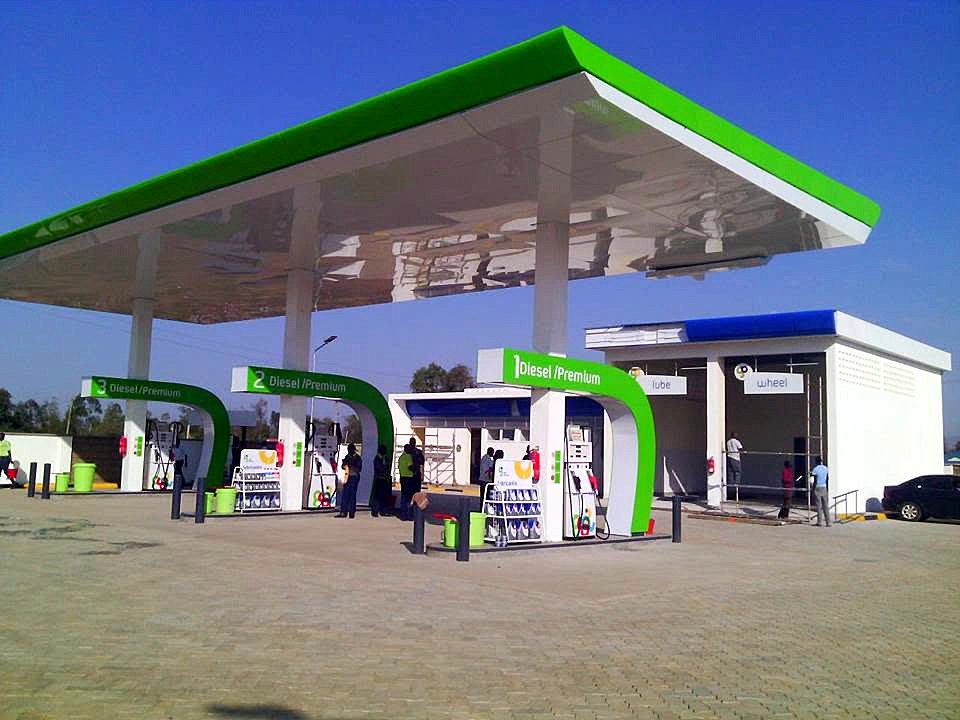 Completed Gulf Energy station with green canopy, dispensers and shop