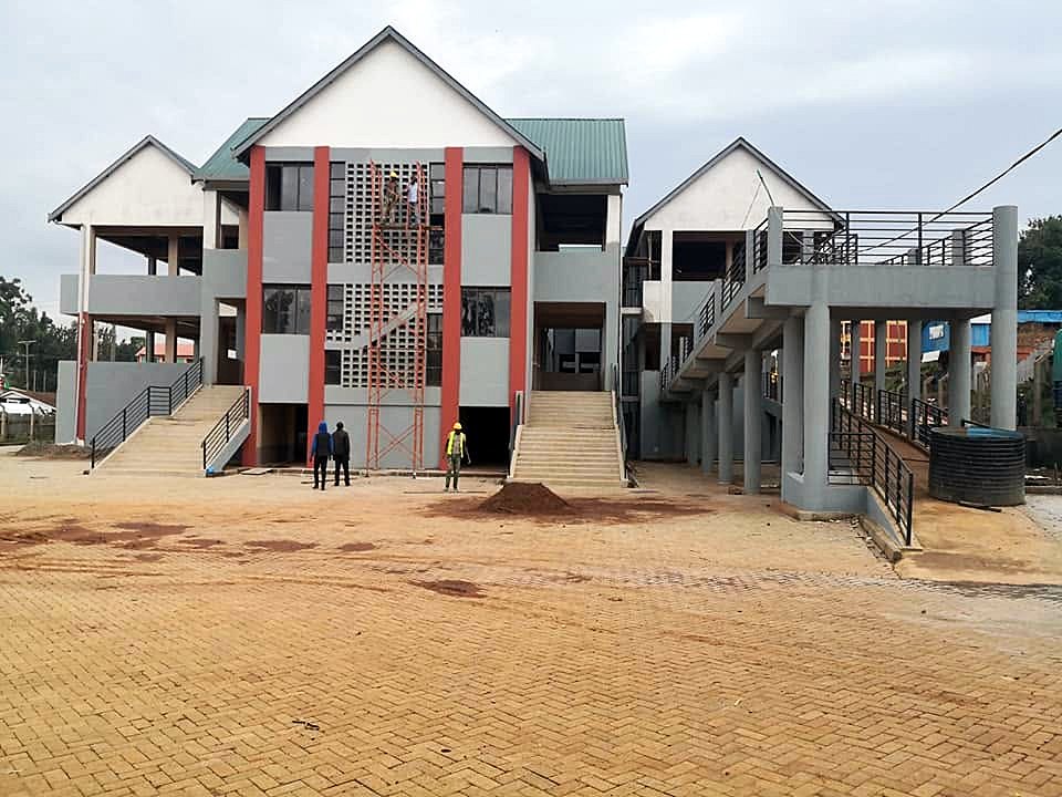 Completed two-storey buildings with a paved frontage, Daraja Mbili Market, Kisii